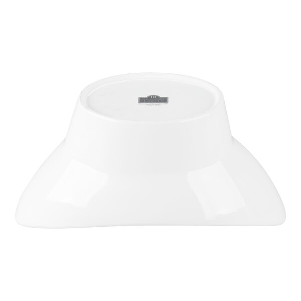 A white porcelain oval bowl shown upside down.