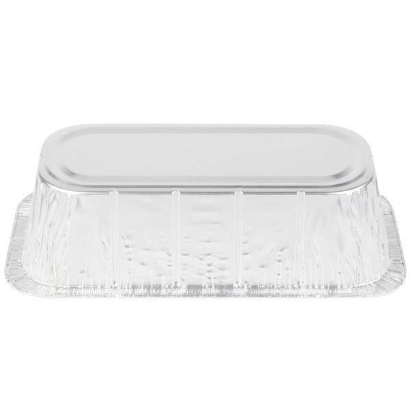 A close-up of a Western Plastics foil steam table pan with a clear plastic lid.