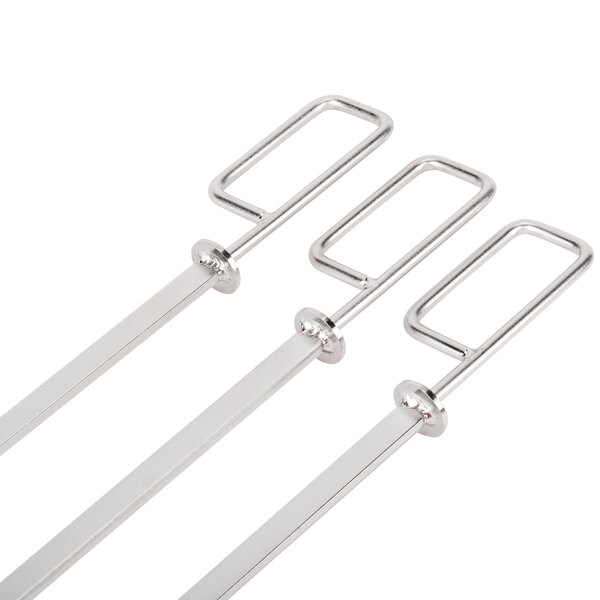 Three Rational stainless steel metal fish skewers with flat handles.