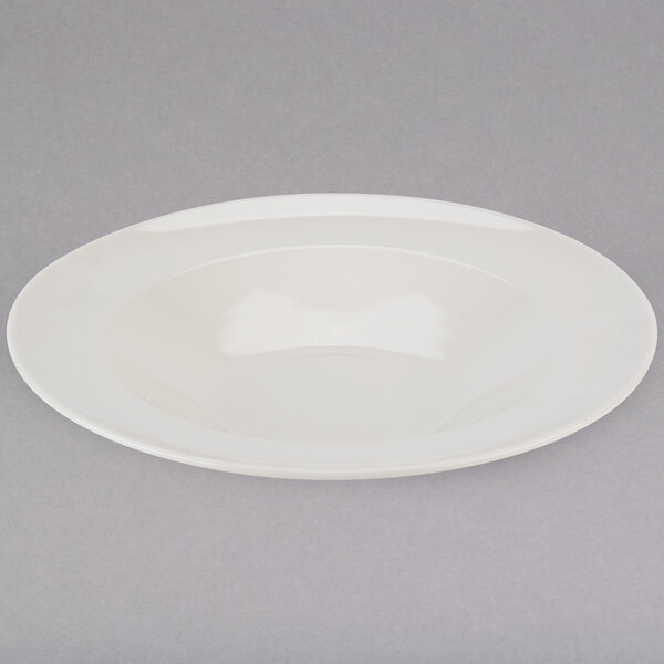 A Tuxton eggshell white china pasta bowl.