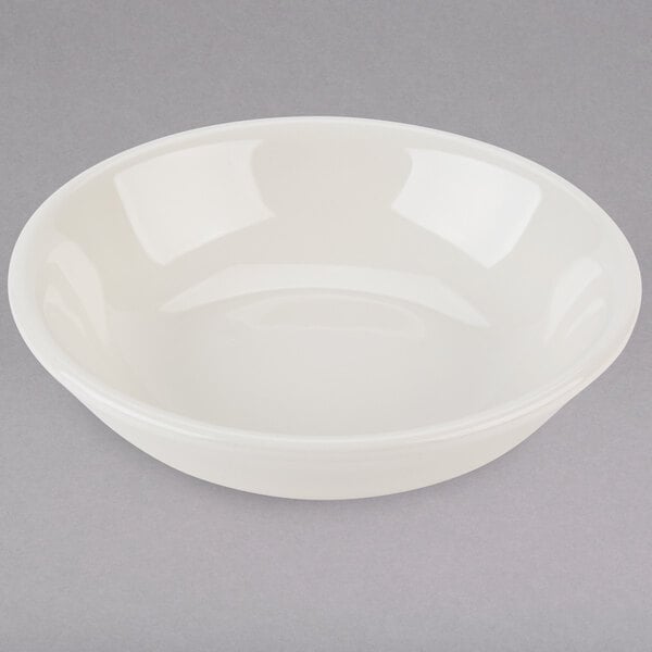 A Tuxton eggshell white china fruit bowl.