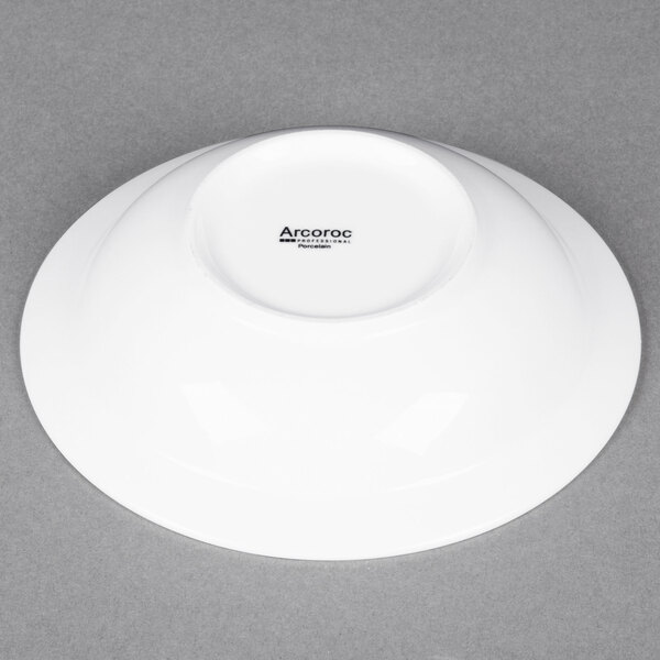 An Arcoroc white porcelain bowl with a white rim.
