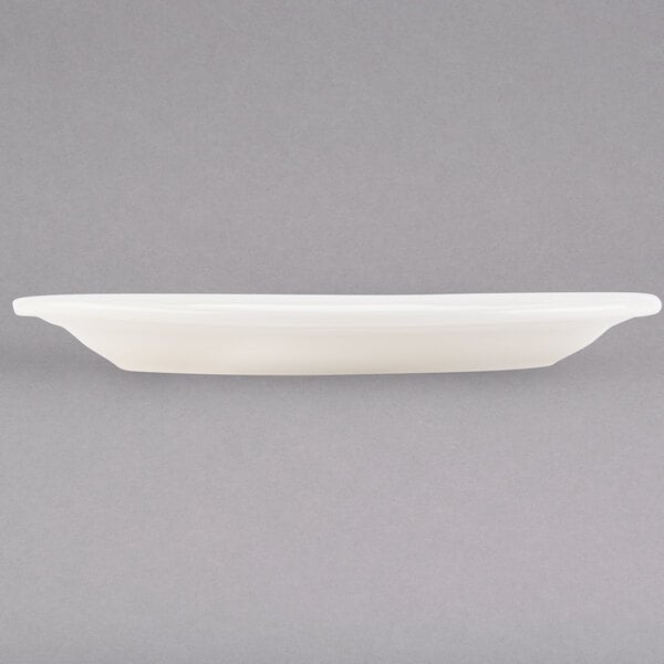 A white rectangular Tuxton china platter on a white surface.