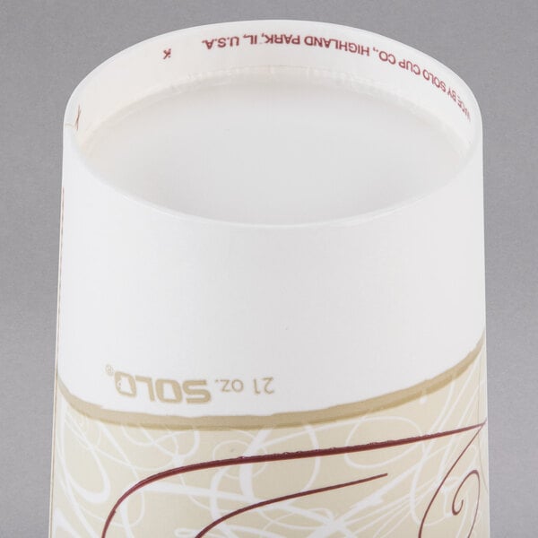 A Solo white paper cold cup with a brown lid.