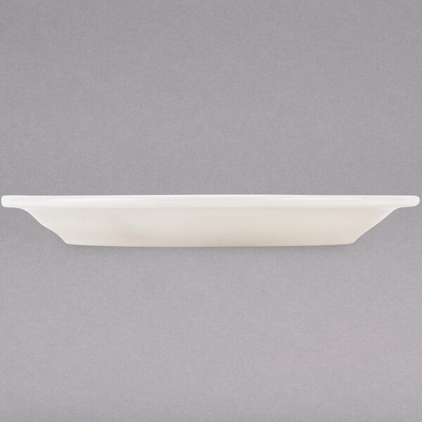 A Tuxton Nevada ivory china plate on a white surface.