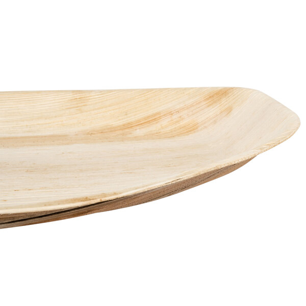 An EcoChoice oval palm leaf tray with a curved edge.