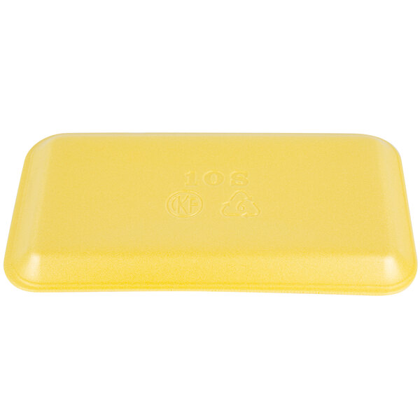 A yellow rectangular CKF foam meat tray with text on it.
