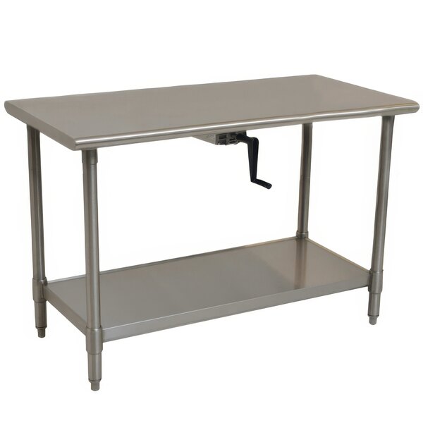 A white metal Eagle Group stainless steel work table with an undershelf.