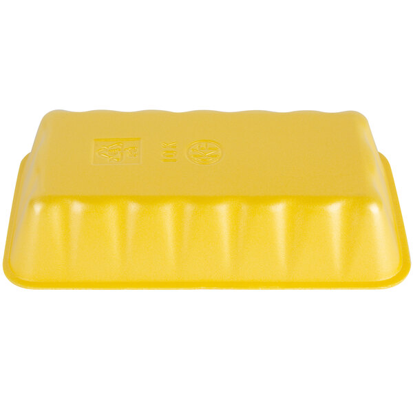 A yellow foam meat tray with a logo on it.