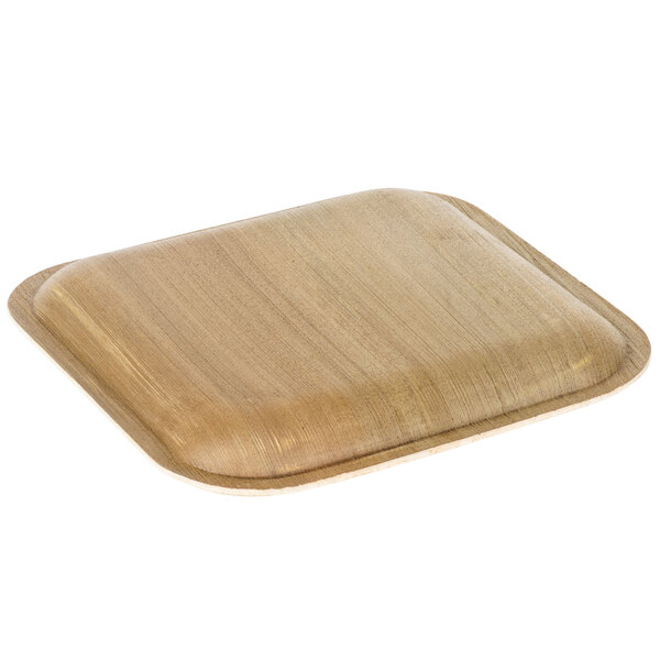 An EcoChoice square palm leaf plate on a table.