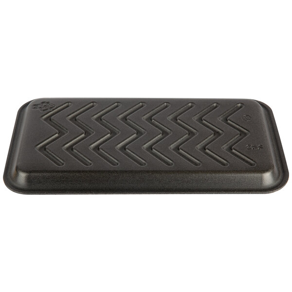 A close-up of a black rectangular CKF meat tray with a zigzag pattern.