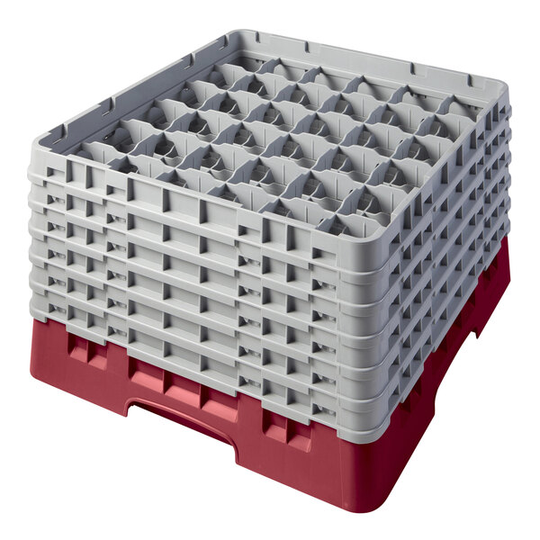 A red and white plastic Cambro glass rack with extenders.