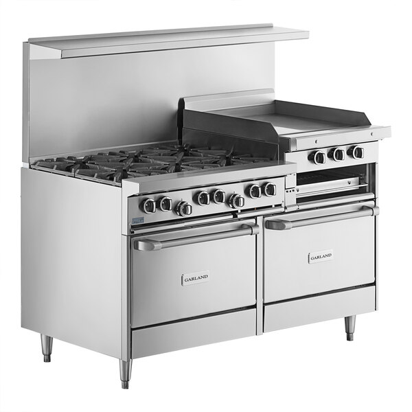 A large commercial stainless steel range with six burners, a 24-inch raised griddle/broiler, and two standard ovens.