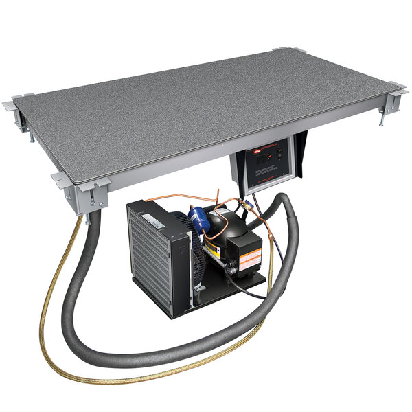 A Hatco Swanstone built-in bottom-mount cold shelf on a metal table.