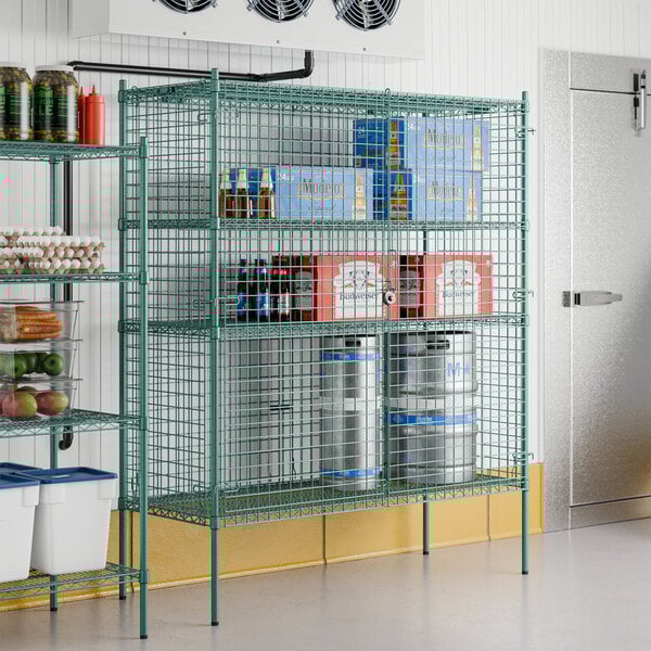 A Regency green wire security cage used as a shelving unit in a brewery tasting room.