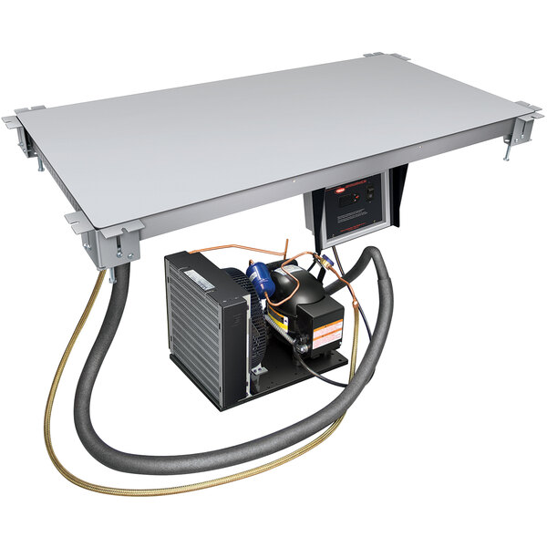 A close-up of a metal panel on a Hatco CSU-48-S undermount cold shelf.