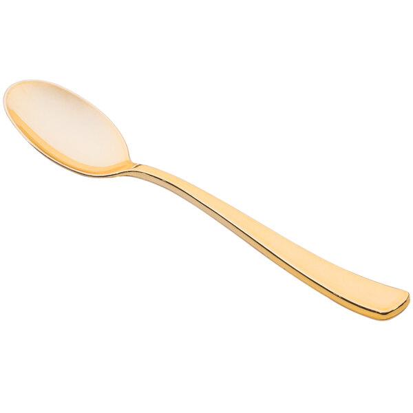 A Fineline gold plastic spoon with a white handle.