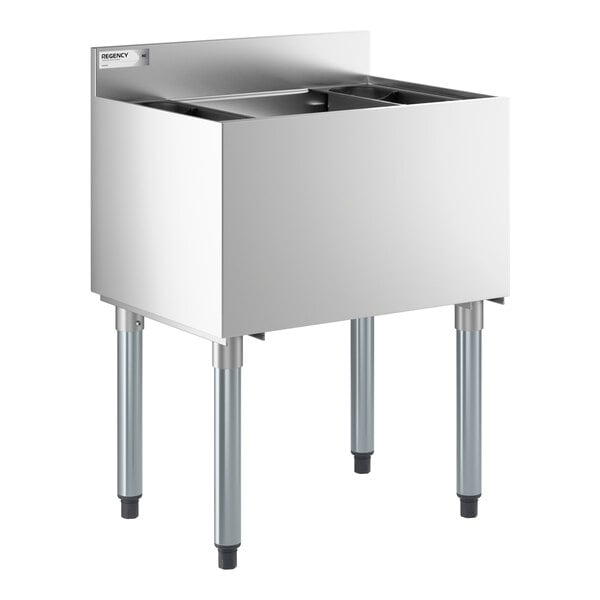 A stainless steel underbar ice bin with bottle holders and four legs.