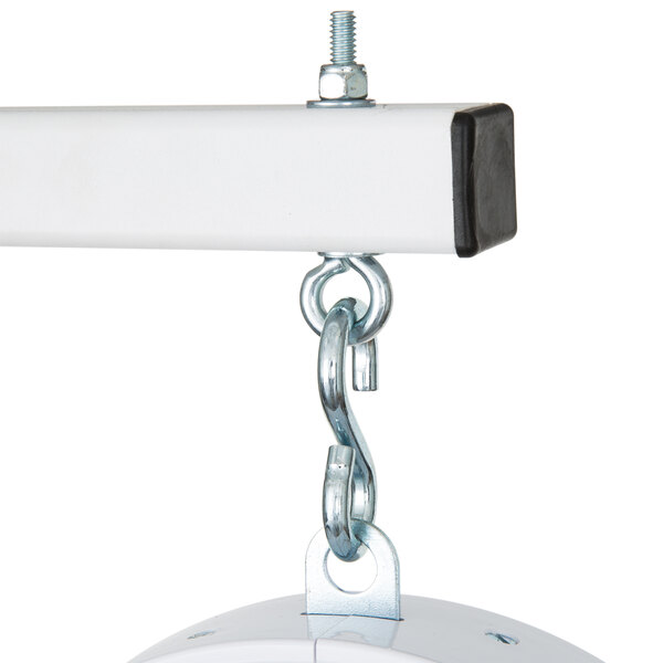 A white Cardinal Detecto hanging scale with a black square scoop on it.