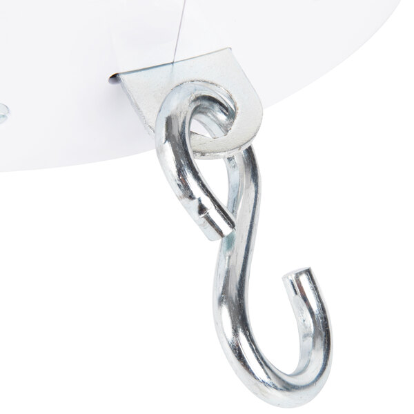 A metal hook attached to a white metal plate.