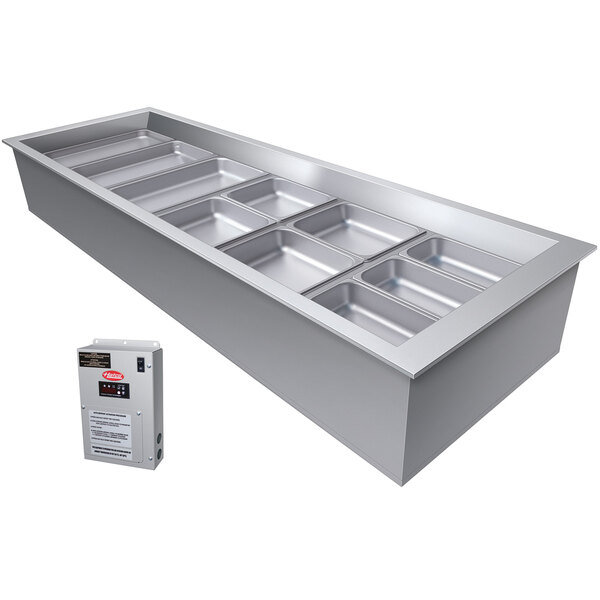 A Hatco slanted stainless steel rectangular container with a tray inside.