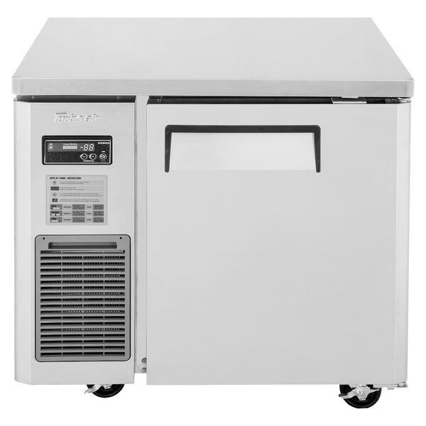 A white rectangular Turbo Air undercounter refrigerator with a door.