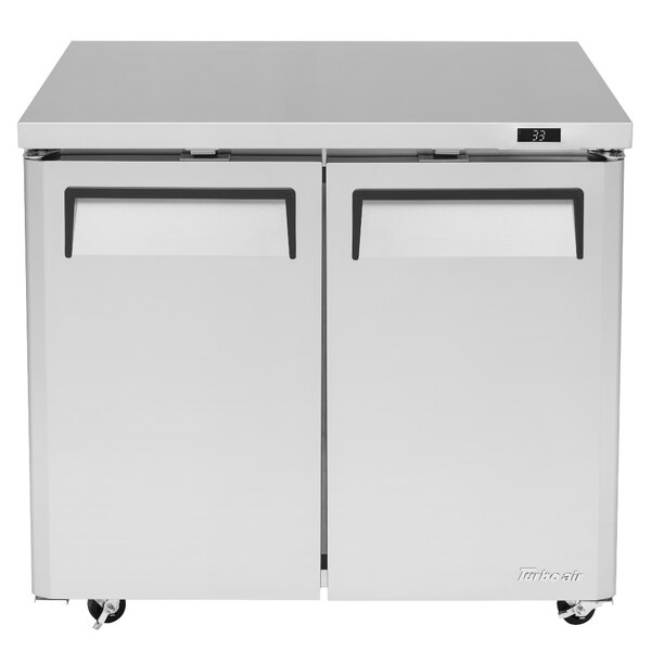 A white Turbo Air M3 Series undercounter refrigerator with two doors.