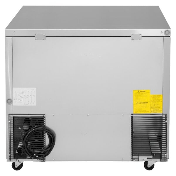 A Turbo Air M3 Series undercounter refrigerator with a metal door and black wheels.