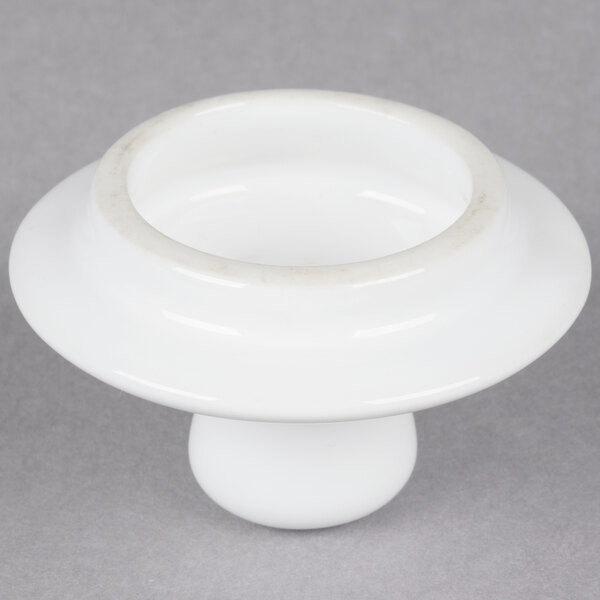 A white Tuxton china teapot lid.