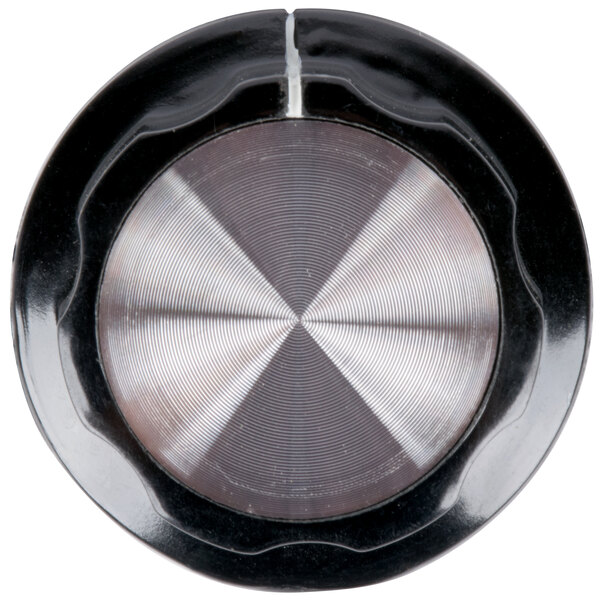 A close-up of a black and silver Avantco control knob with a metal center.