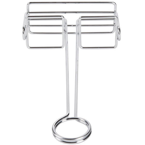 A chrome metal rack with three round metal bars.