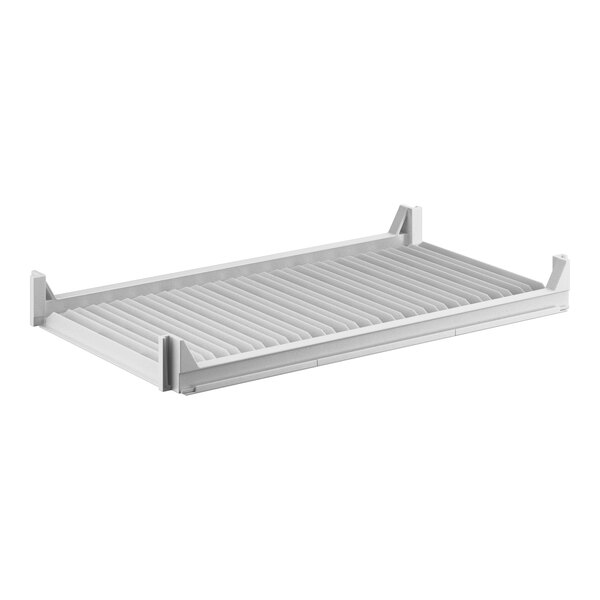 A white rectangular shelf with metal vents.