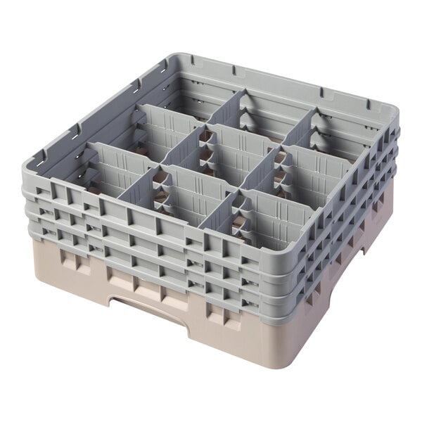 A beige plastic Cambro glass rack with nine compartments.