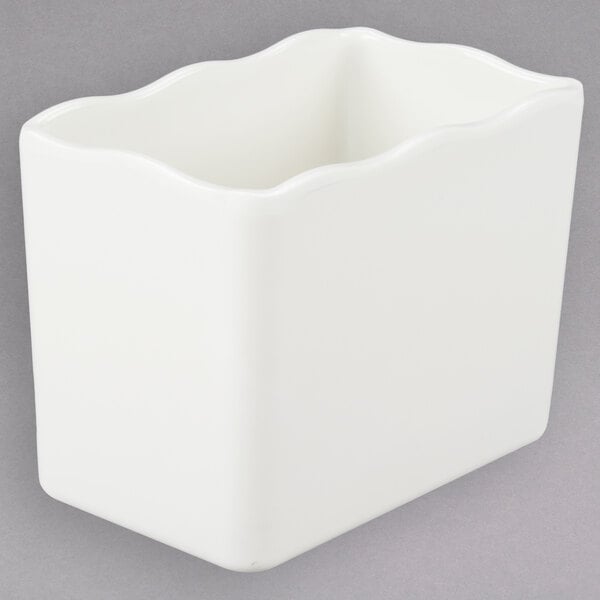 A white square deli crock with wavy edges.