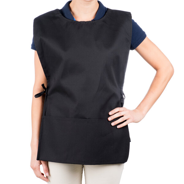 A woman wearing a black Intedge cobbler apron.