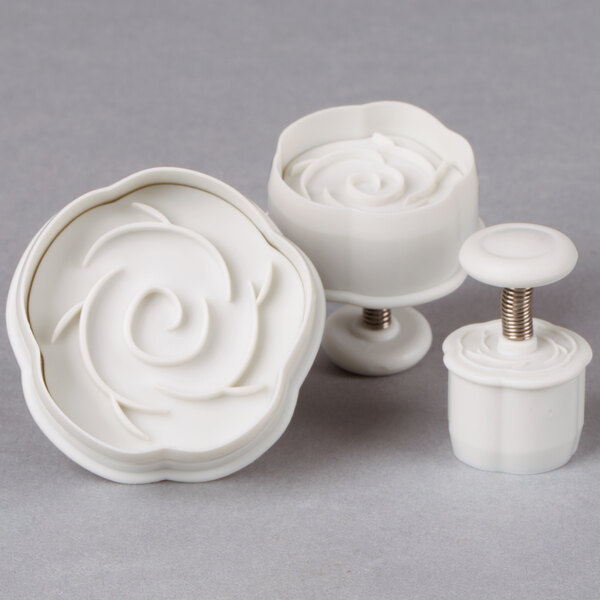A white plastic 3-piece Ateco rose plunger cutter set.