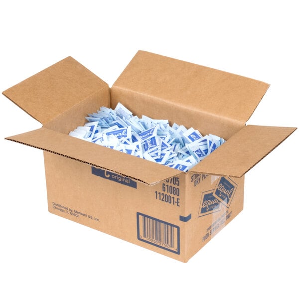 A white box filled with small blue and white Equal sugar substitute packets.