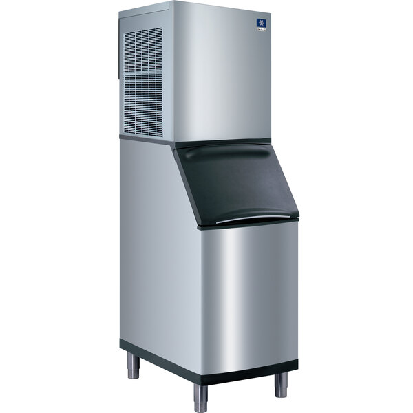 A white Manitowoc water cooled nugget ice machine with a black top.
