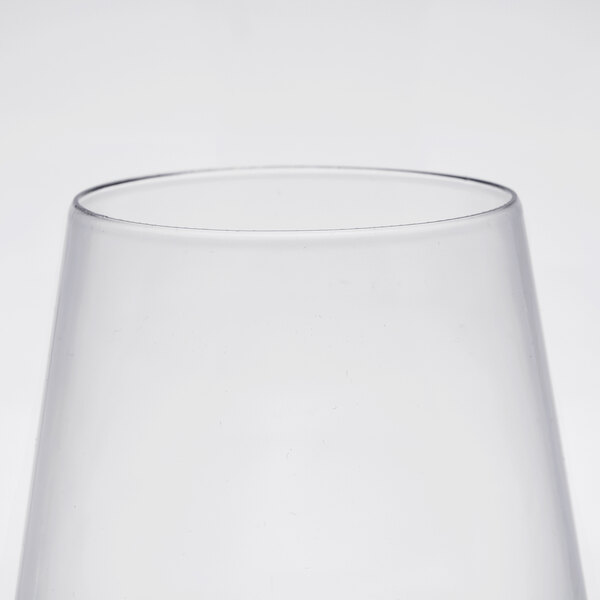 A close-up of a clear plastic stemless wine goblet.