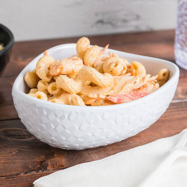 A white GET Coralline melamine bowl filled with pasta and sauce.