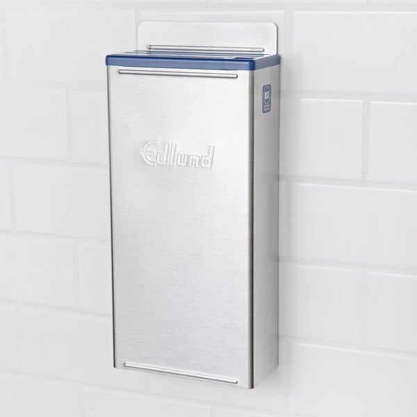 An Edlund stainless steel knife rack with blue insert.