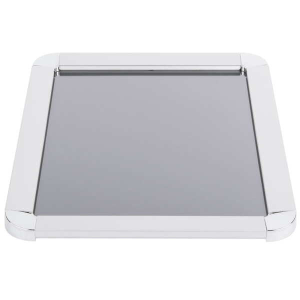An Aarco satin aluminum rectangular snap frame with round corners on a counter.