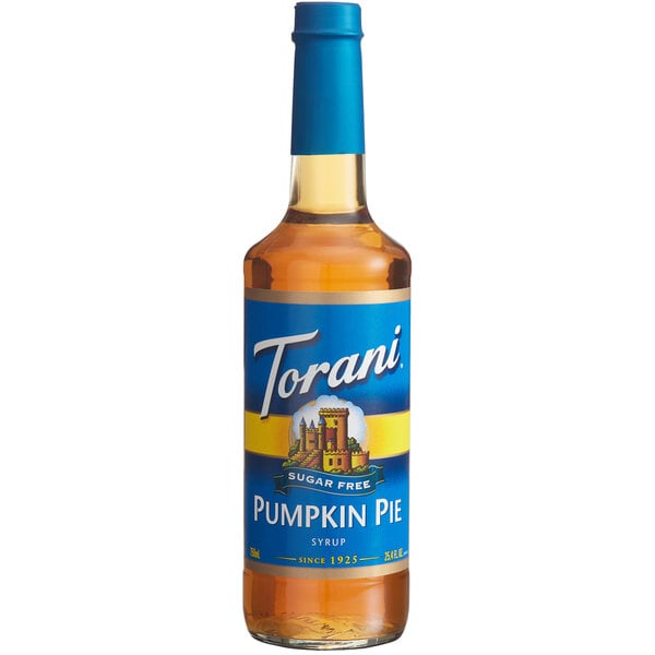 A Torani Sugar-Free Pumpkin Pie Flavoring Syrup 750 mL glass bottle with a blue label.