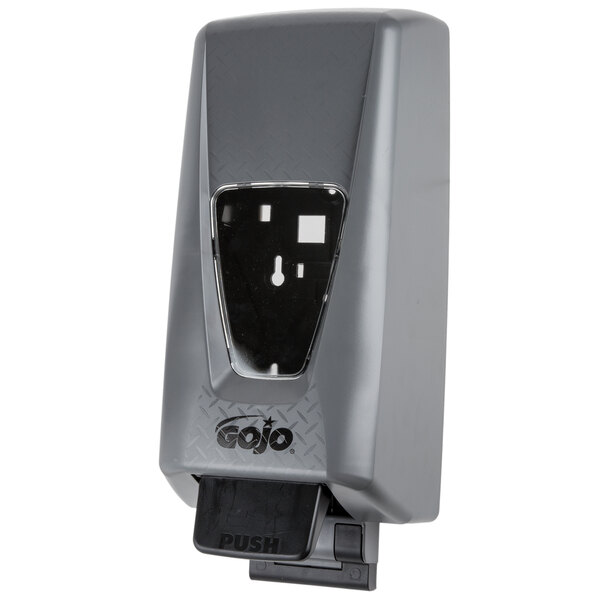 A grey GOJO soap dispenser with a black plastic lid.