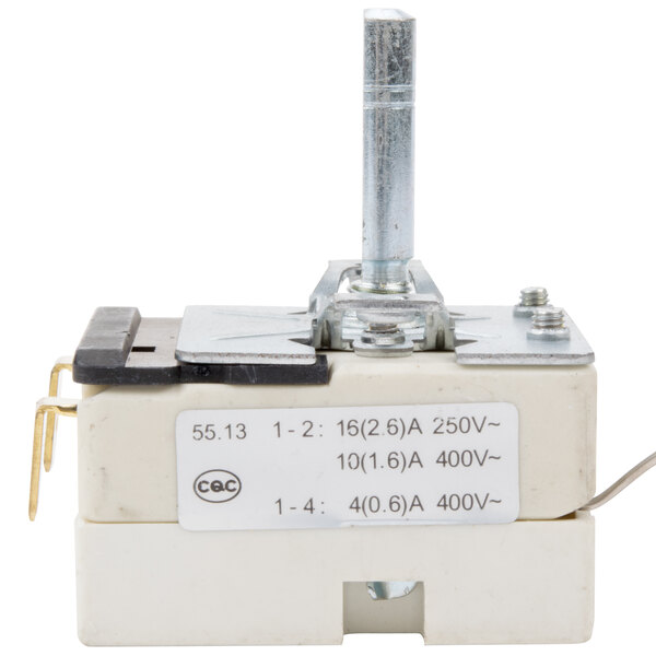 A close-up of a white and black Carnival King thermostat.