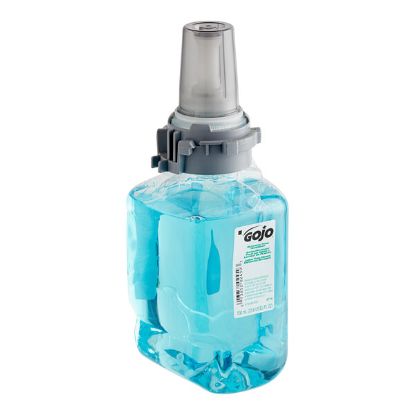 A close-up of a bottle of GOJO Botanical blue liquid hand soap with a blue lid.