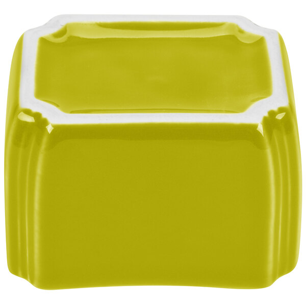 A yellow and white ceramic square Fiesta sugar caddy.