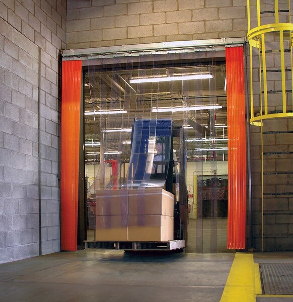 A warehouse with a forklift and yellow PVC strip curtains.