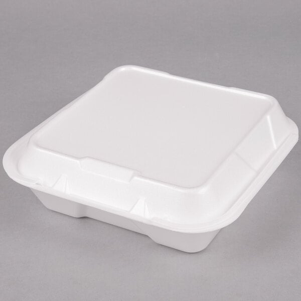 A white Genpak foam takeout container with a hinged lid.