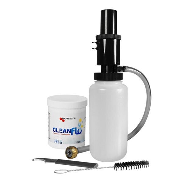 A Micro Matic beer dispenser cleaning kit with a white bottle and a black and white brush in a white container.